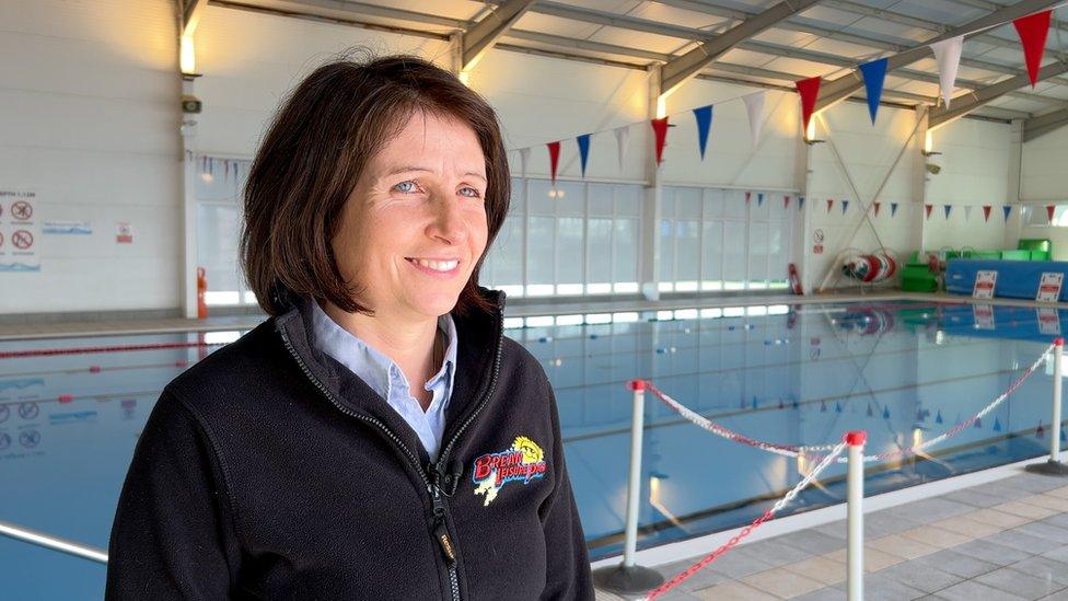 Sarah Spottiswoode of Unity Park at Brean with an indoor swimming pool behind her