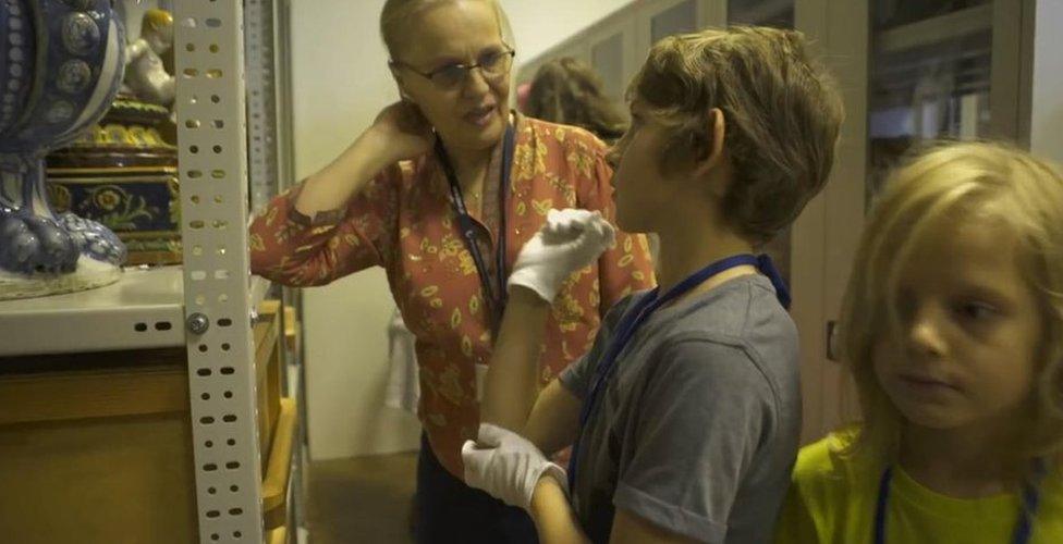 Children in a museum storeroom