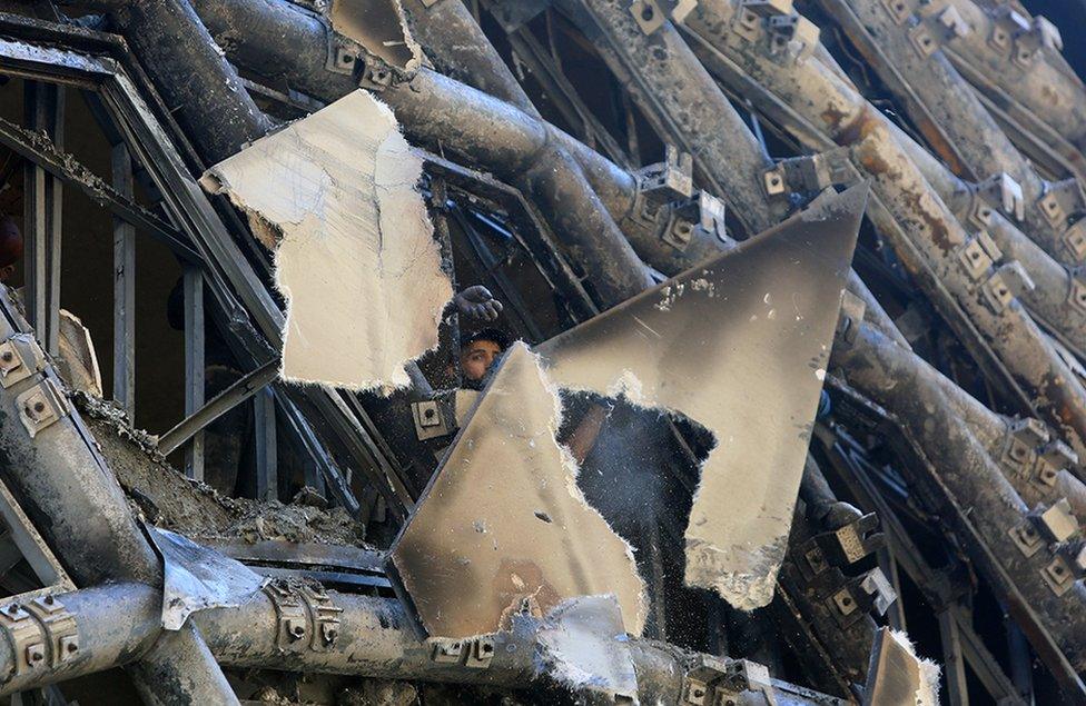 A man checks the damage after a fire erupted in a landmark building in Beirut's commercial district, Lebanon, 15 September 2020.