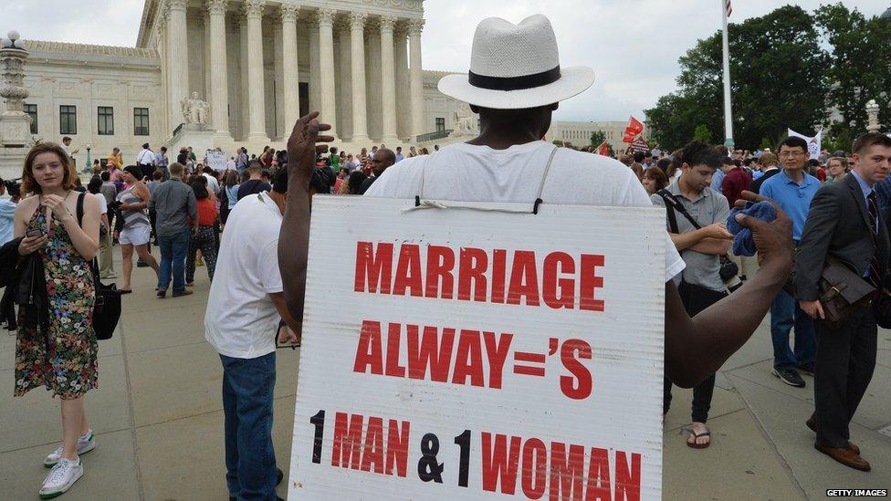 A man protests gay marriage outside the Supreme Court.