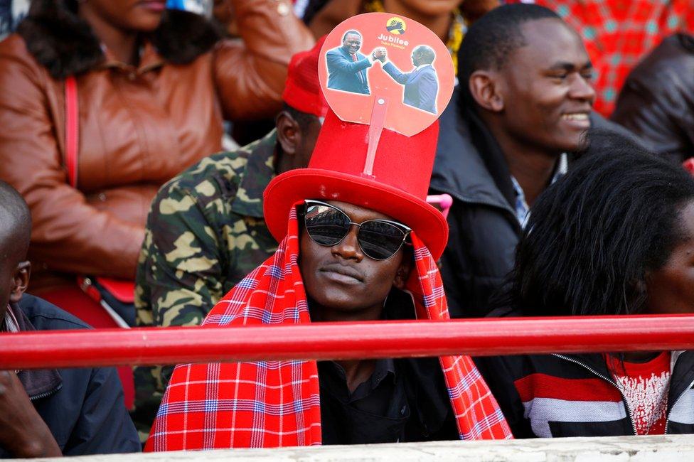 A man waits ahead of the inauguration ceremony for Uhuru Kenyatta at Kasarani Stadium in Nairobi, Kenya, 28 November