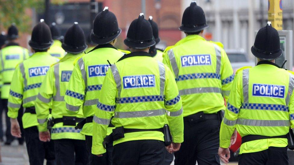 Police officers wearing hi-vis jackets in Manchester