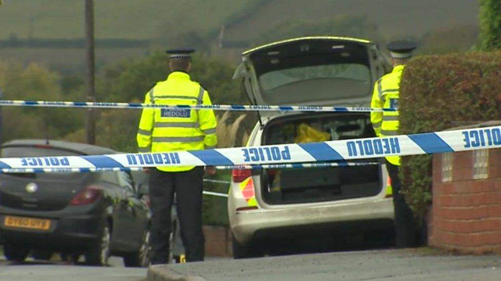 Police at the scene in Llay