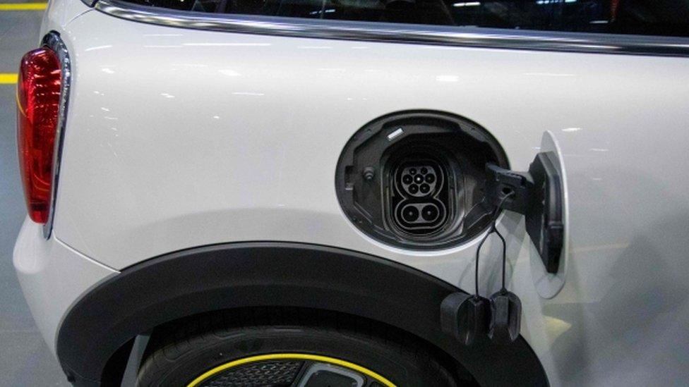 Electric charging point on a car