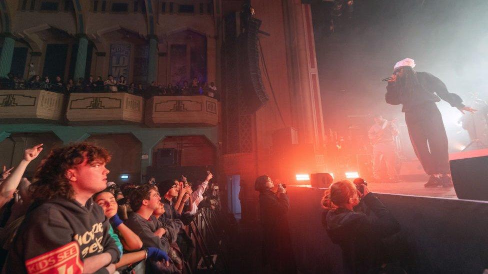 Little Simz performing at a gig.