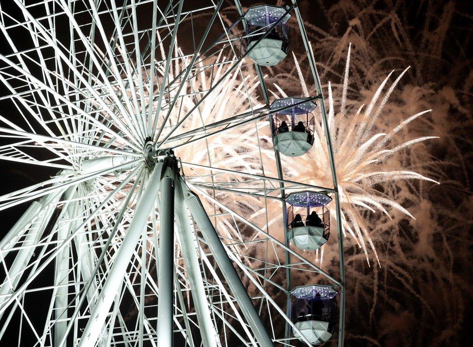 Fireworks explode over the Wheel of Light during Diwali celebrations in Leicester