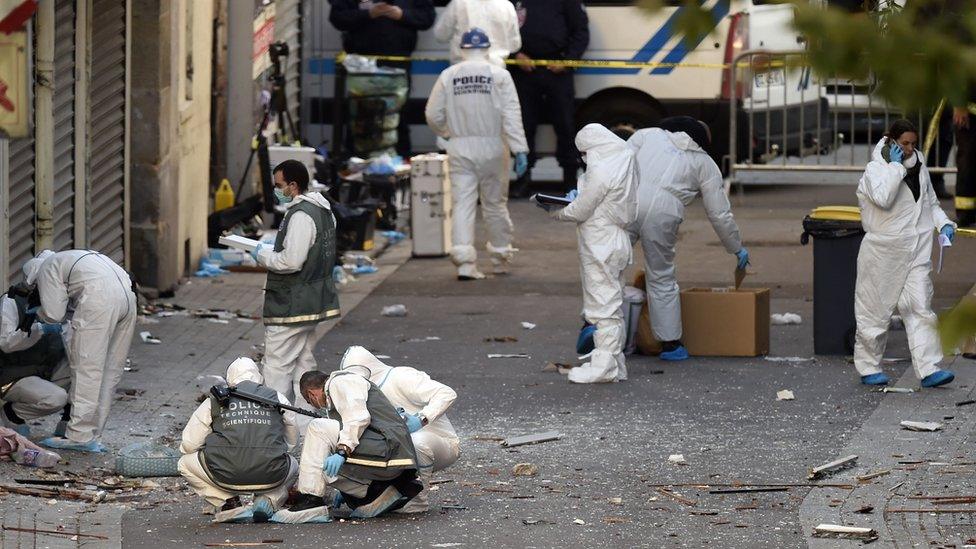 French police search the aftermath of an anti-terror operation in France