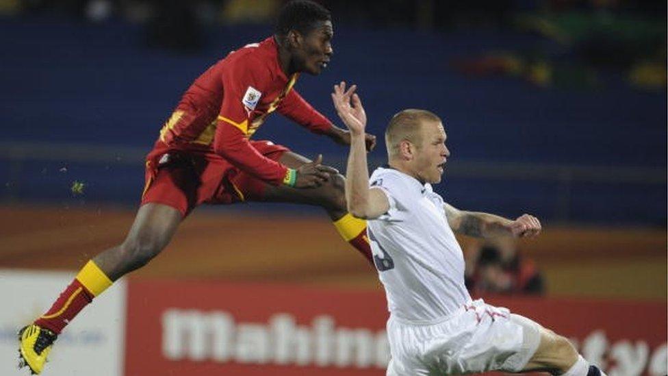 Ghana's striker Asamoah Gyan (L) scores against the USA during extra time of their 2010 World Cup round of 16 football match at Royal Bafokeng stadium in Rustenburg, South Africa, on June 26, 2010