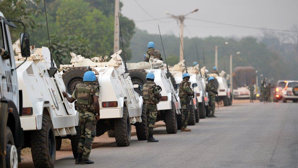 A picture taken in Bouake on January 6, 2017 shows an UN Blue Helmet peacekeepers convoy parked at the entrance of the city where soldiers demanding more pay and housing rose up earlier in the day.