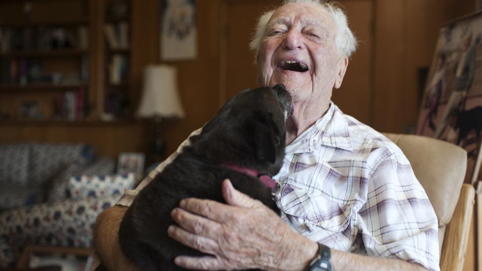 Milt laughing while holding layla