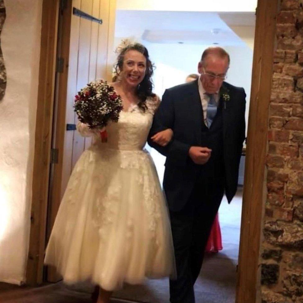 Natasha arm in arm with her father, Richard, at her wedding