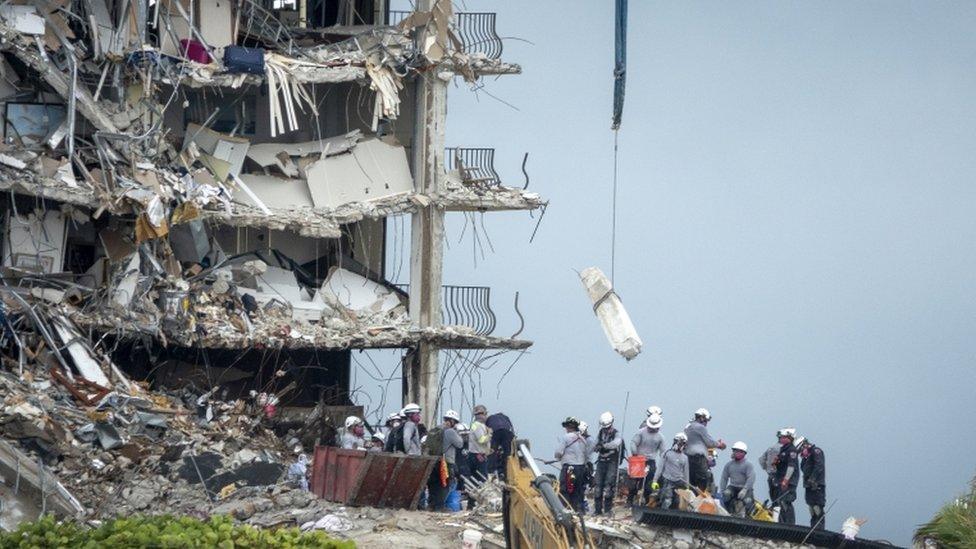 Rescue team search the partially collapsed Champlain Towers South condominium building in Surfside, Florida,