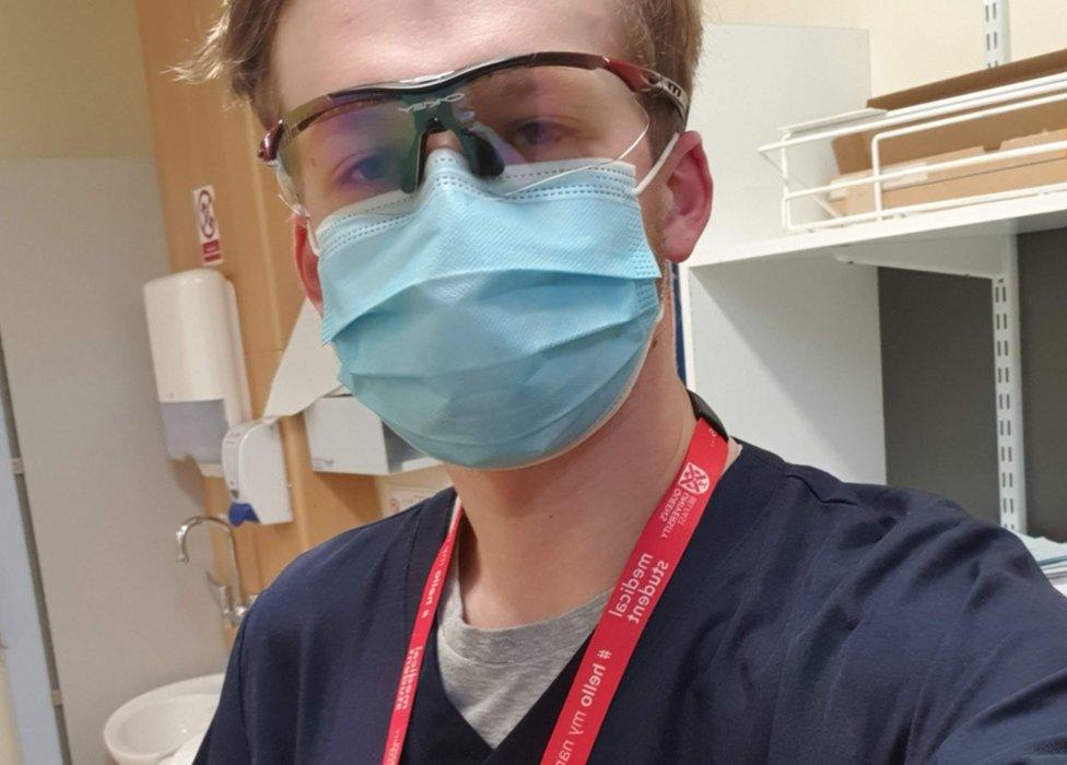 Tim Neill wearing a facemask while working as a doctor on a placement during the Covid-19 pandemic