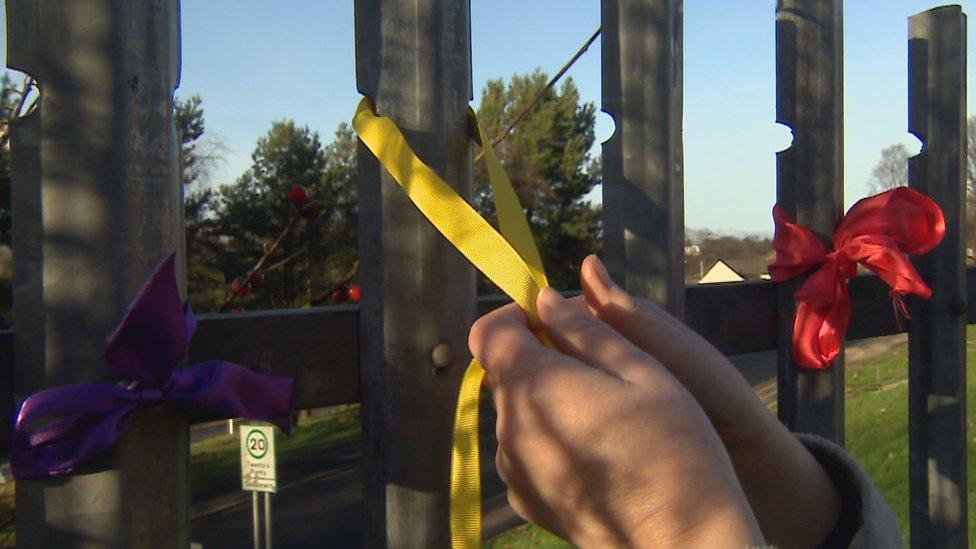 ribbons on fence