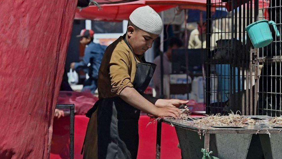 boy working on a stall