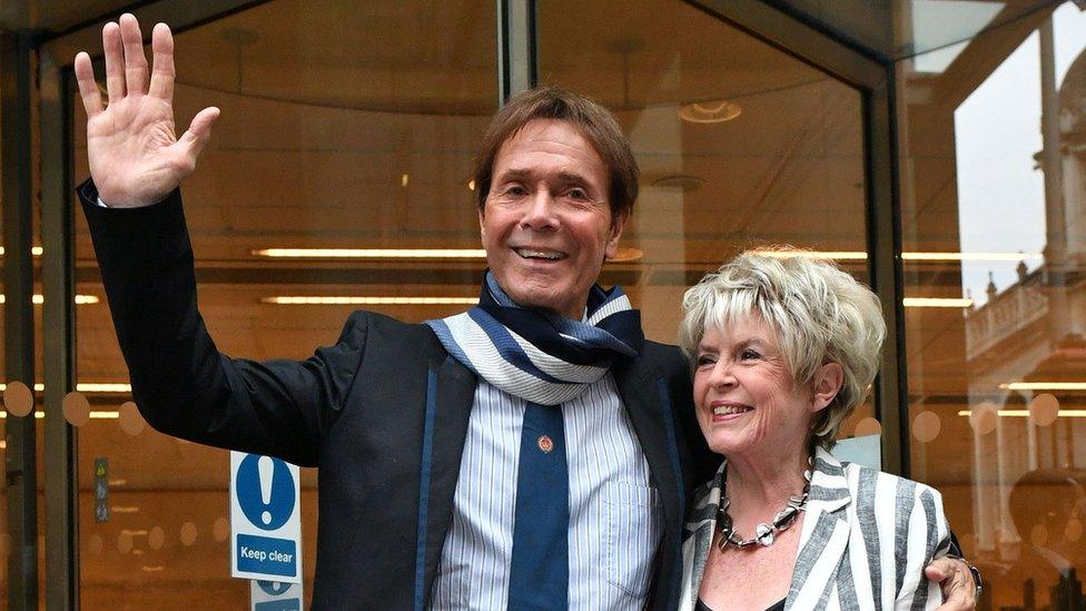 Sir Cliff Richard leaving at the High Court on 13 April 2018 with Gloria Hunniford