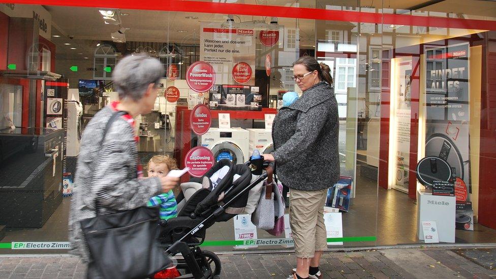 Shoppers outside a kitchen appliance retailer in Gutersloh, Germany