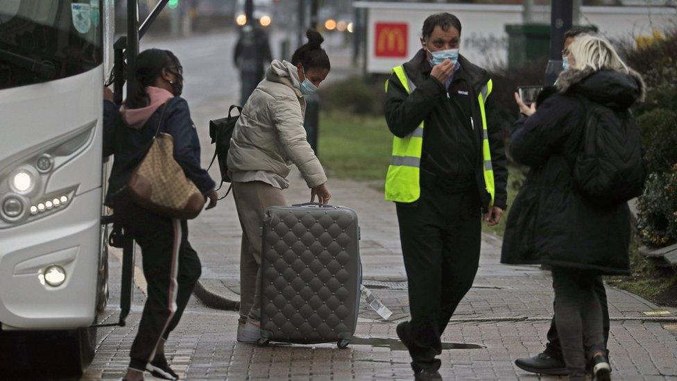 People arrive for hotel quarantine