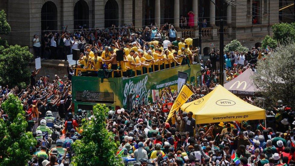 South African rugby team wave to supporters during the Springboks Champions trophy tour at Church Square in Pretoria on November 2, 2023