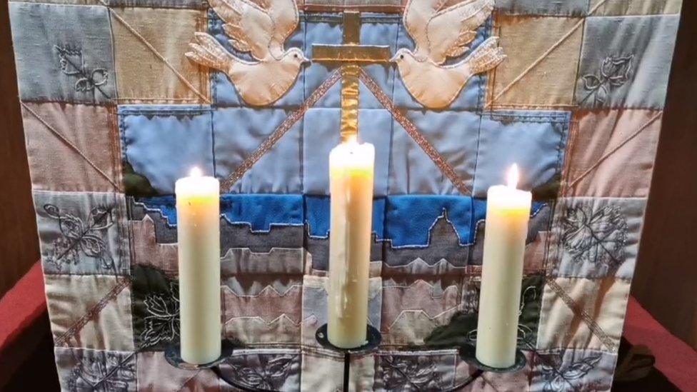 Three candles lit at St Paul's Church