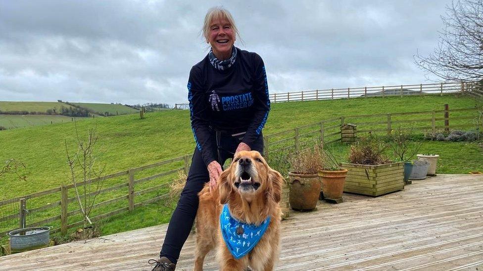 Susan Saker and a golden retriever, Abi