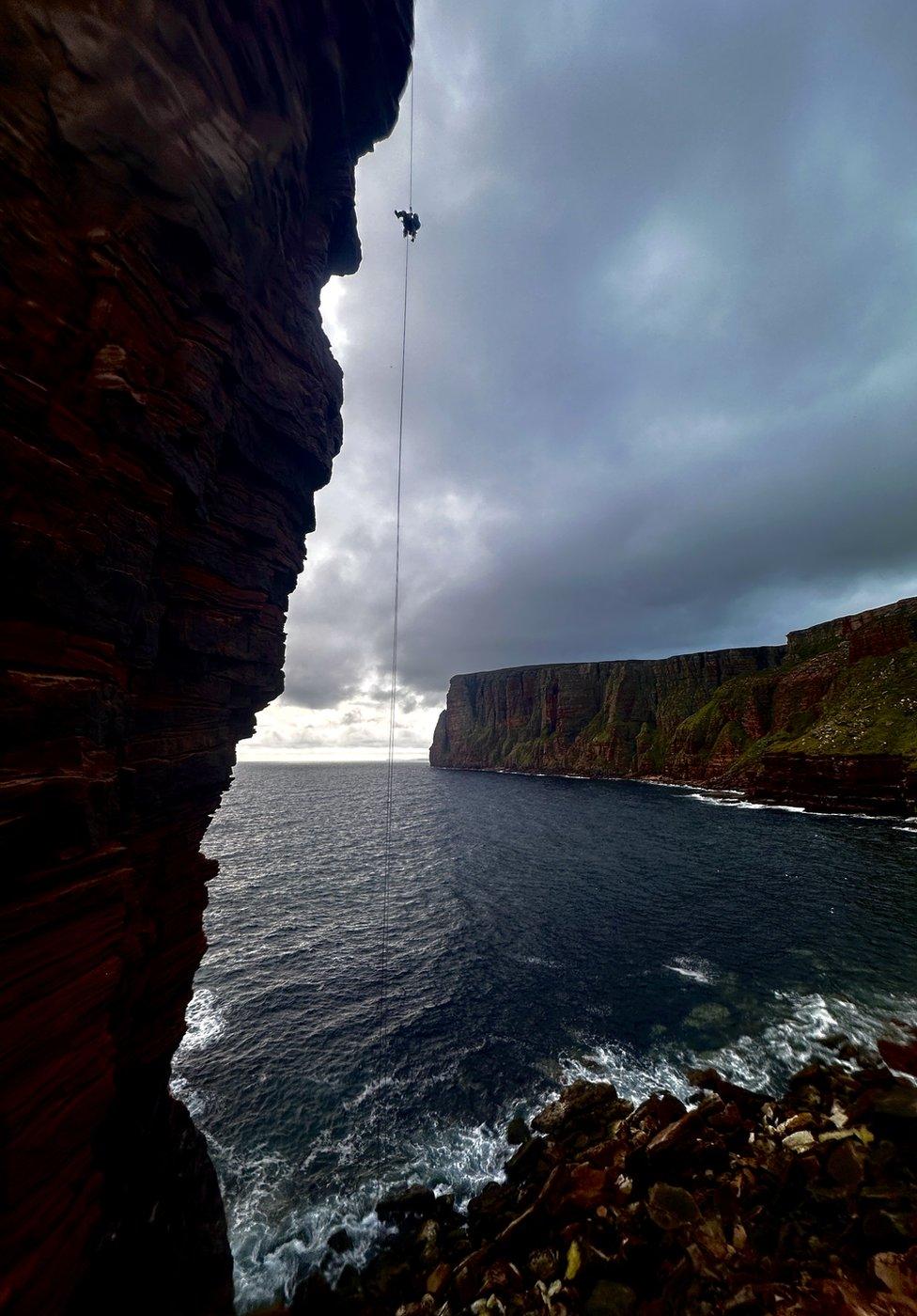 Darren Lunn abseiling off the Old Man