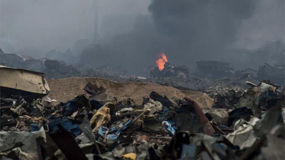 A fire continues to burn on the second morning after a series of explosions at a chemical warehouse hit the city of Tianjin, in northern China on August 14, 2015