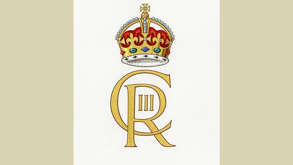 The cypher of King Charles III shows the letters C and R intertwined with III in the middle. A crown sits on top of the letters.