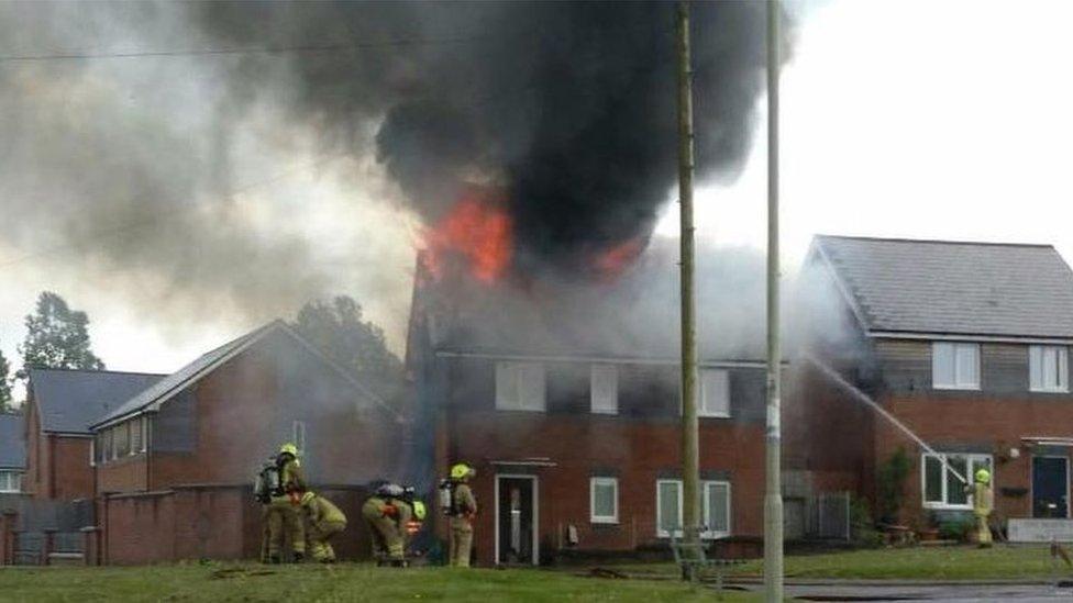 Hirwaun house fire showing flames coming from the roof