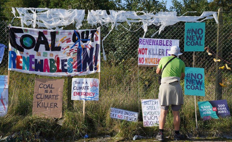 Protesters outside the planned site