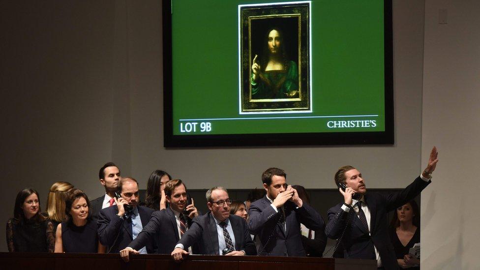 Christie's employees take bids for Salvator Mundi in New York