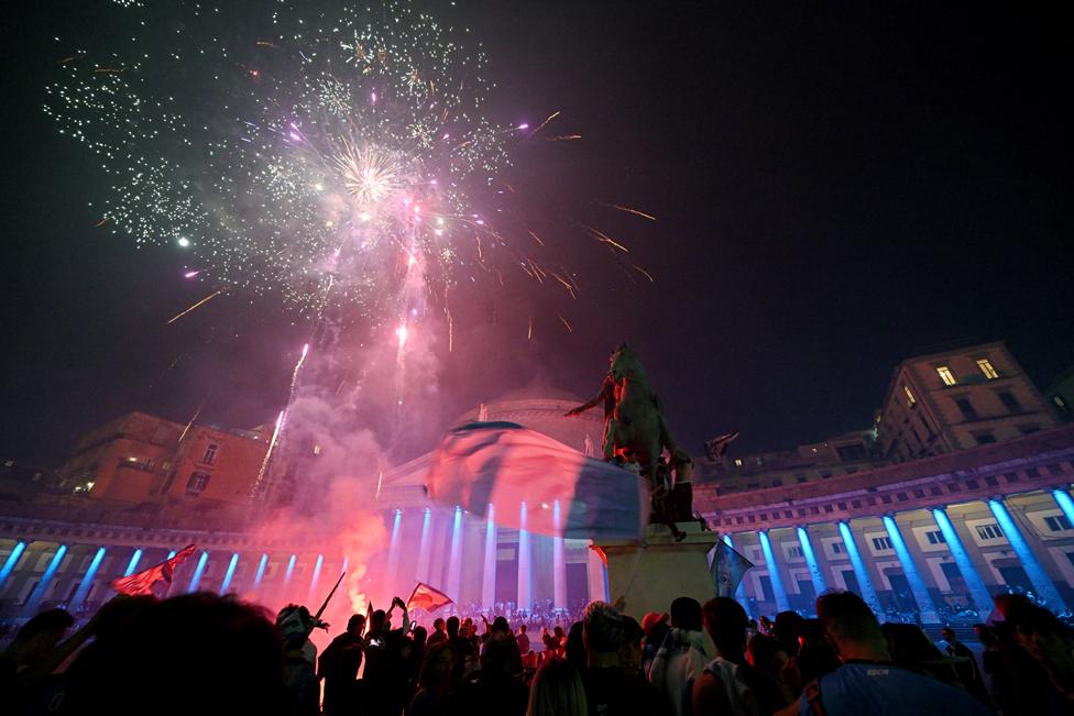 Crowds of SSC Napoli celebrate with fireworks in central Naples