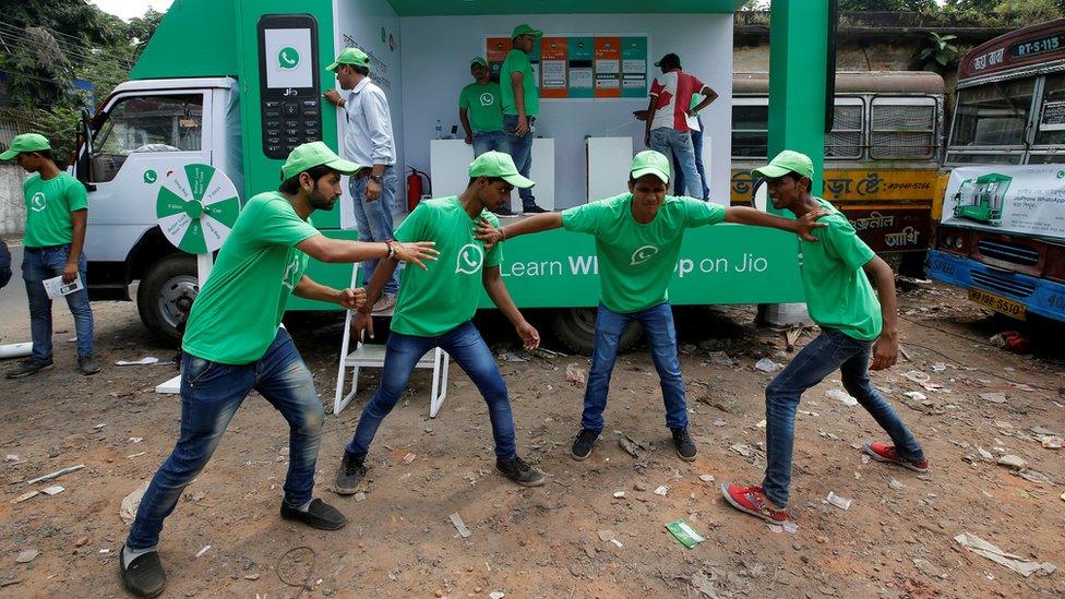 Actors in WhatsApp shirts perform a skit in Jaipur in October 2018