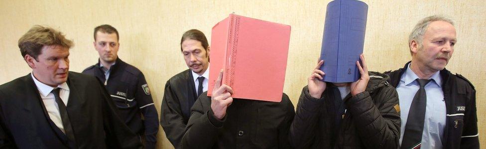 Defendants hide their faces in court in Cologne (24 Feb)