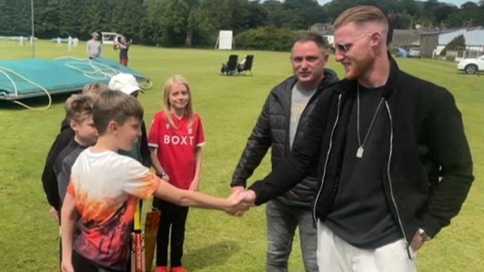 Ben Stokes shaking hands with young fans at Cockermouth Cricket Club