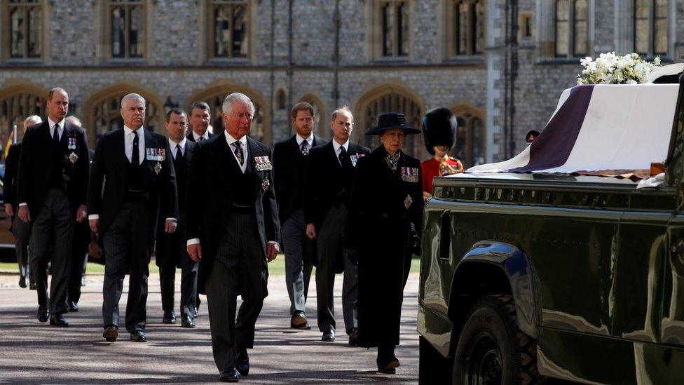 Prince Charles, Princess Anne and members of the Royal Family walk behind the duke's hearse on the grounds of Windsor Castle