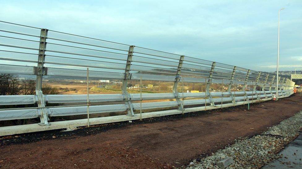 The wind barrier is being tested on an approach road to the bridge