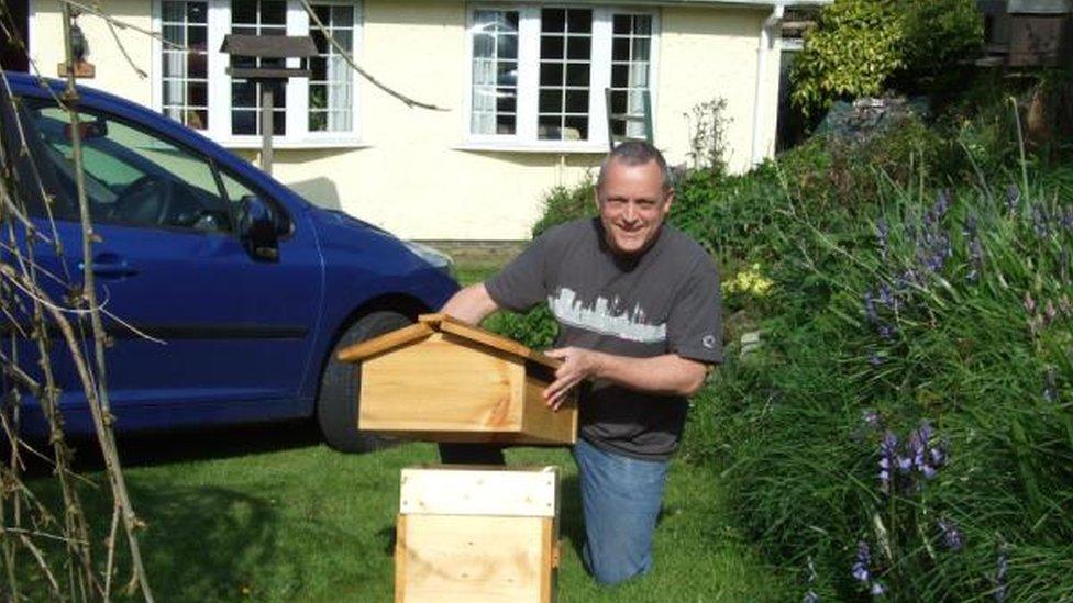 Chris Hickman with his hive in Tywyn