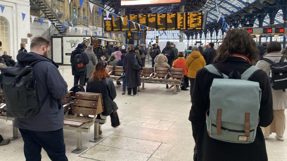 Passengers waiting at Brighton Station