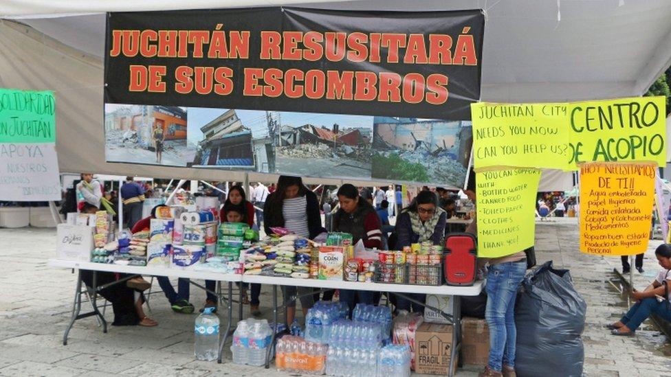 Women work at stall providing aid