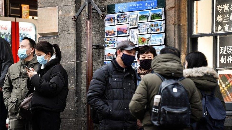 Tourists in masks in Edinburgh