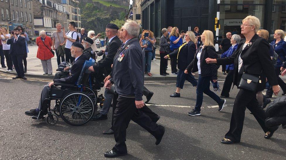 servicemen and women march through central Edinburgh for the annual Armed Forces Day