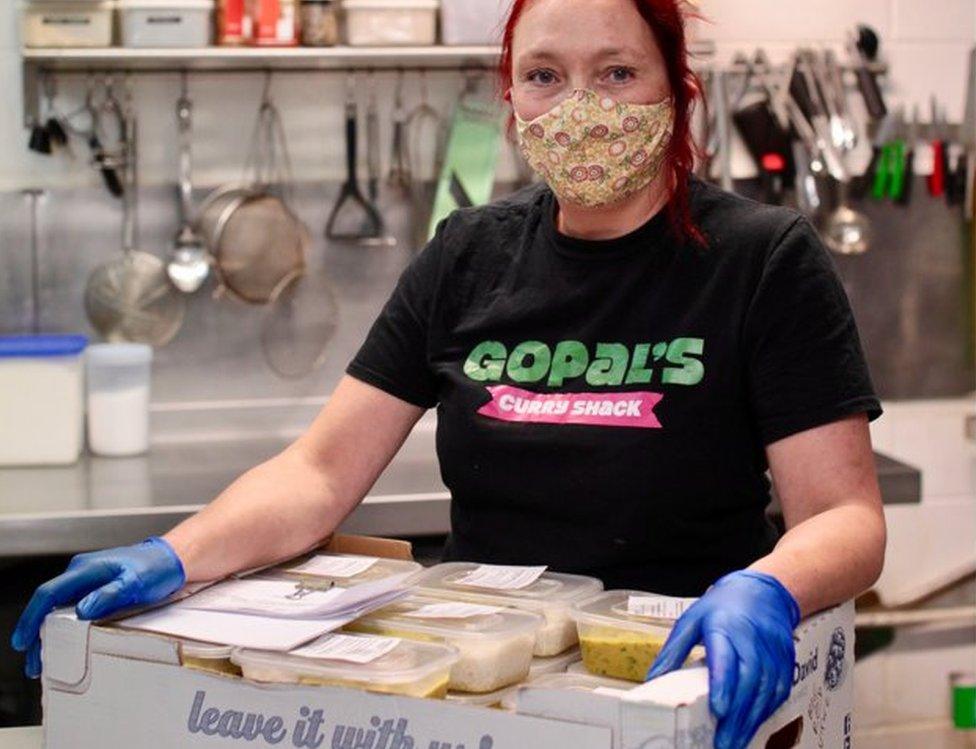 Woman with take-away food boxes