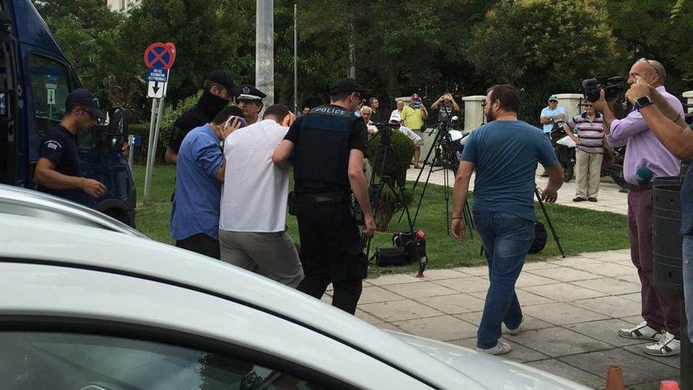 Turkish military officers are escorted to the courtroom in Alexandroupoli, Greece (18 July 2016)