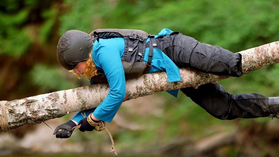 Hannah crosses a log