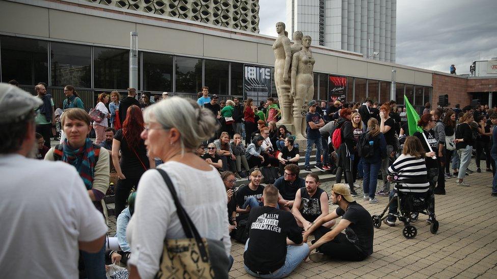 People gather for a demonstration to protest against racism and right-wing extremism in Chemnitz, 27 August