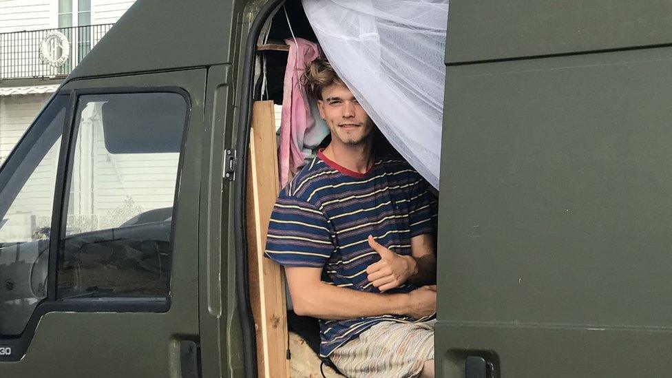 Man in a converted van