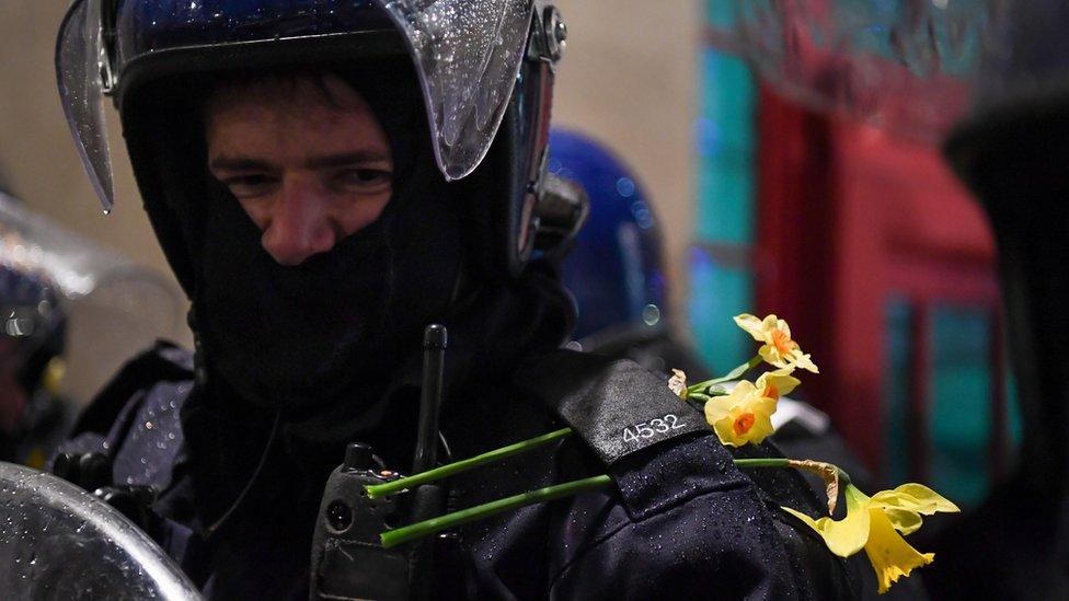 Policeman at Kill the Bill march in Bristol with daffodil in his lapel