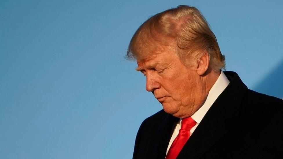 US President Donald Trump steps off Air Force One upon return to Andrews Air Force in Maryland on January 18, 2018.