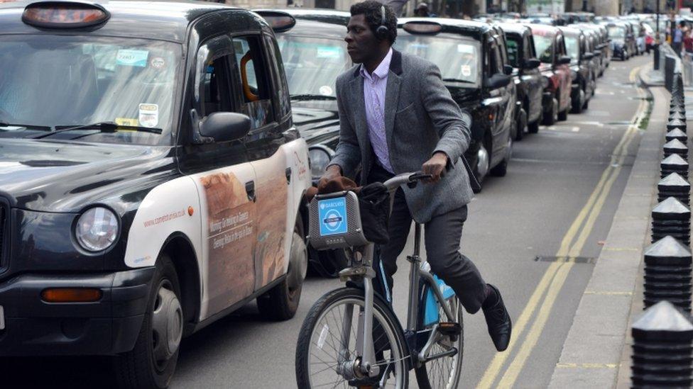 man on boris bike